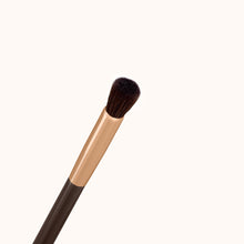 Load image into Gallery viewer, Small, detailed dome-shaped makeup brush with a dark brown lacquered handle and a rose gold ferrule, made by mixing handmade synthetic dark brown bristles with a few strands of white bristles.
