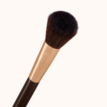 Load image into Gallery viewer, A light airy soft dome-shaped face makeup brush with a dark brown lacquered handle and a rose gold ferrule, made by mixing handmade synthetic dark brown bristles with a few strands of white bristles.
